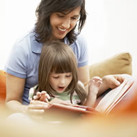 Woman and child reading a book